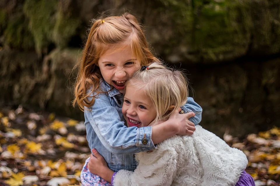 Children smiling and hugging