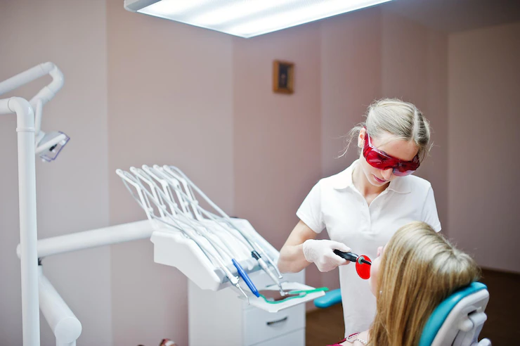 Female dentist treating a patient