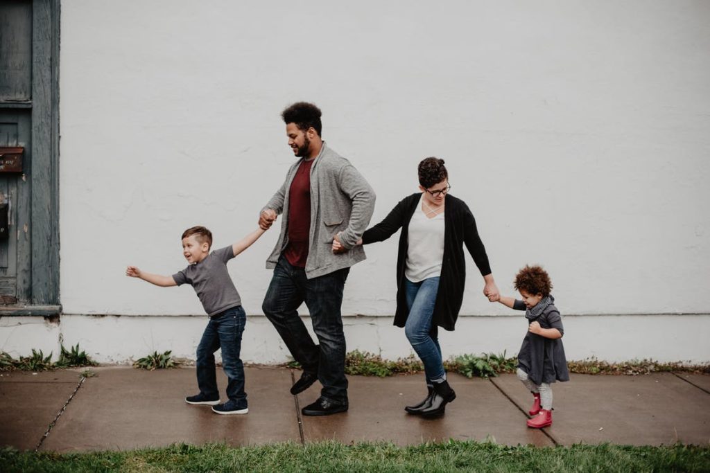 Family of four walking on the street