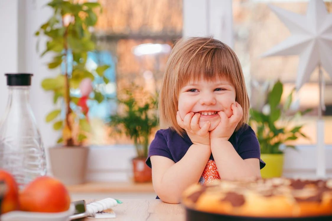 A toddler smiling