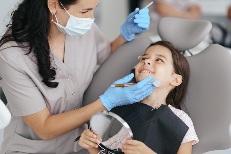 Little girl smiling at the dentist