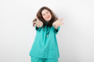 Young girl with Down syndrome posing with a stethoscope